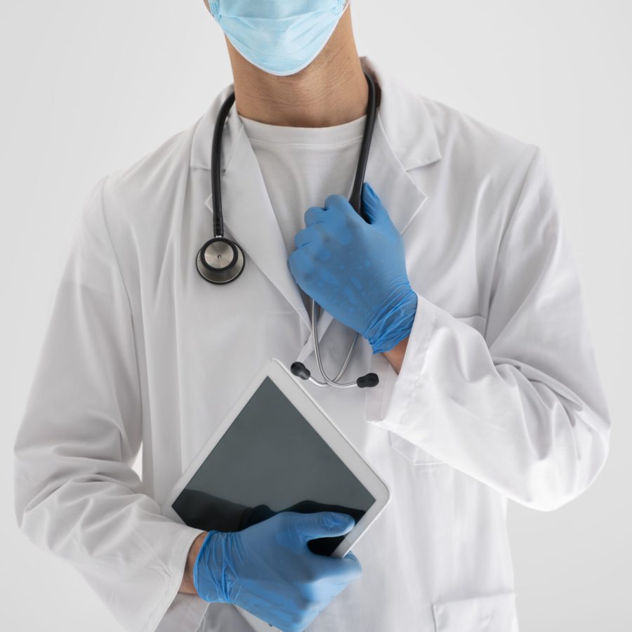 front-view-doctor-holding-tablet